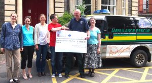 Members of the University of Bristol's German Dept presenting the cheque for £1055 to Duncan Massey, Chair of A&SSAR.