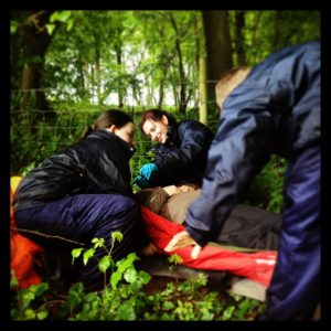 North Somerset police cadets place a casualty in a vacuum mattress during a search and rescue exercise with ASSAR.