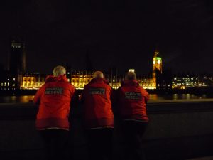 Mountain Rescue looking across River Thames at Parliament, London.